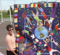 Pam Keeling examines the quilt close-up.